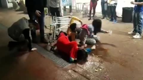 Three people in shopping cart fall