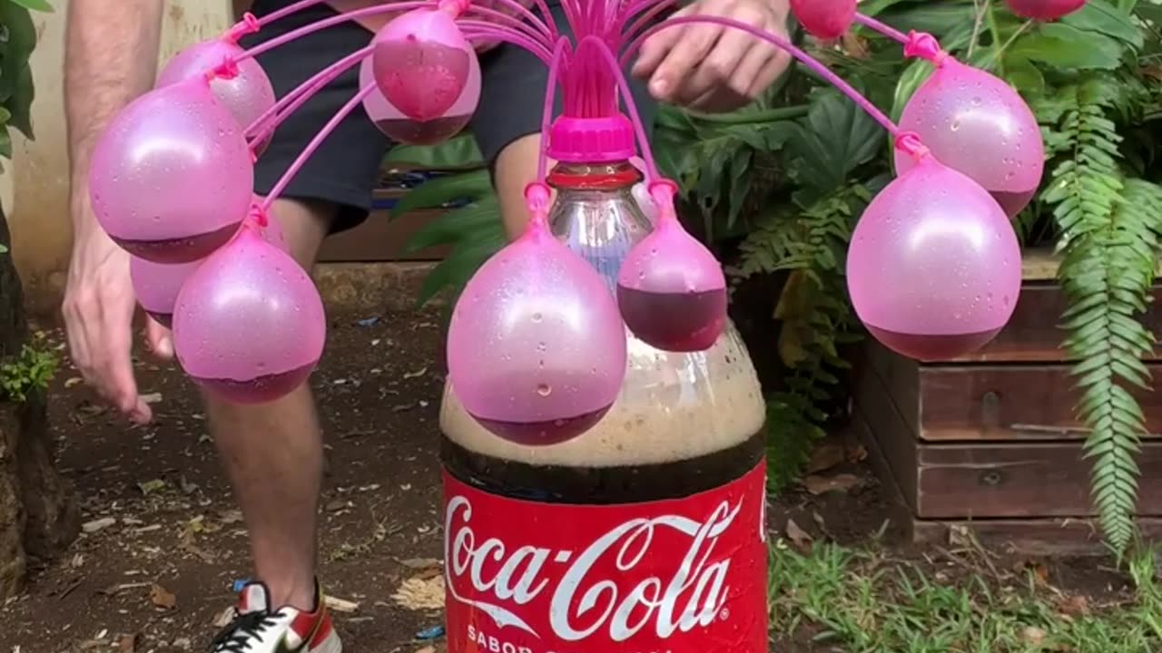 Mentos and Coke VS 30 Water Balloons!