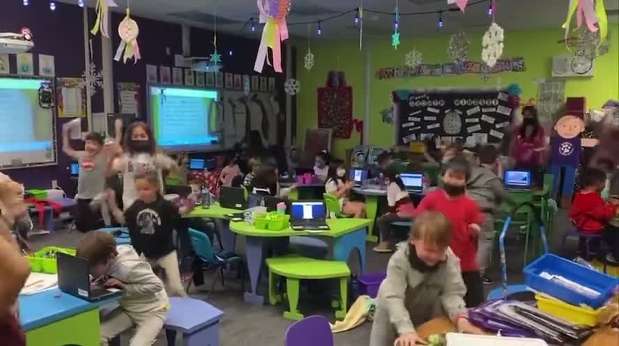 Children in Las Vegas rejoice as the teacher announces mask mandates are to be lifted.