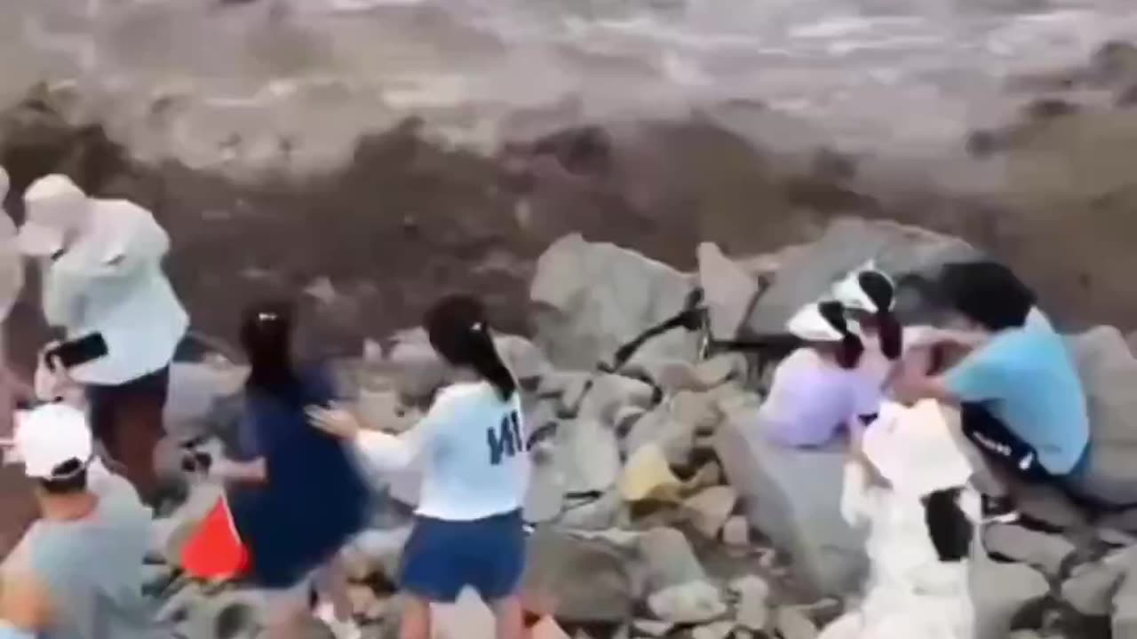 People trying to record the Qiantang River in China on video were swept away