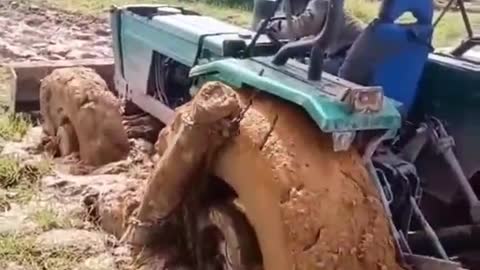 A tractor stuck in the mud. How do you get out