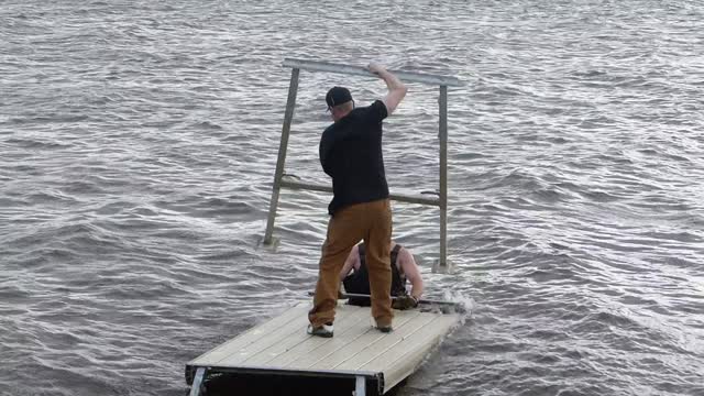 Dock Collapses Into Lake