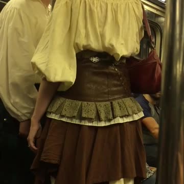 Couple subway train renaissance clothes