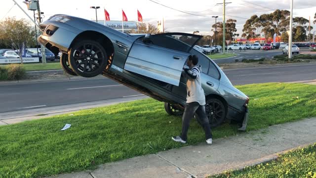 Car Attempts to Reverse Off of a Power Line