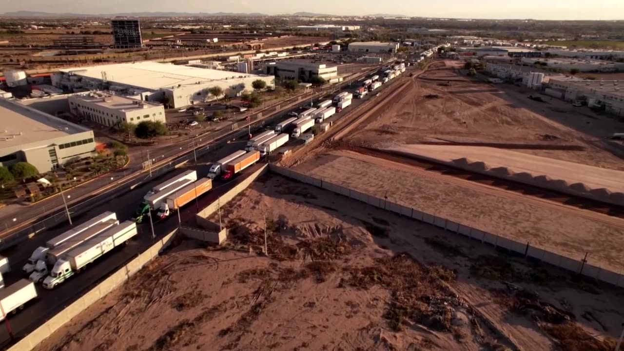 Long truck lines after U.S. suspends Juarez crossing