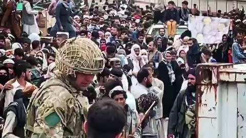 Video by PBS shows crowd outside the gates of Kabul airport