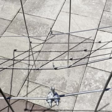 How to Set Up a Trellis System for Earthbox Containers Using Pea Fences and Wire Ties.