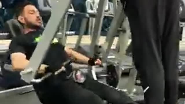 Ahmed zaher exercising using monaga instead of the dumbells