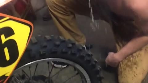 Nsfw shirtless guy pours beer into motorcycle exhaust and blows into face