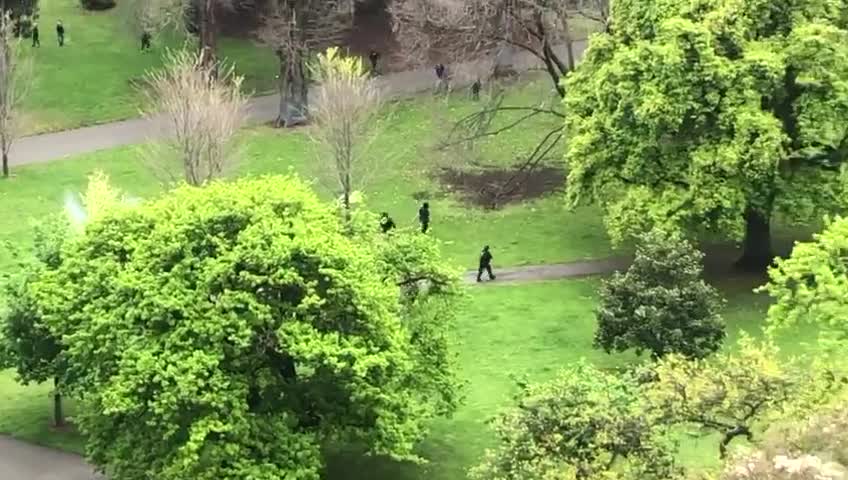 Melbourne, Australia: Ariel view of marxist police opening fire on anti clotshot mandateprotesters.