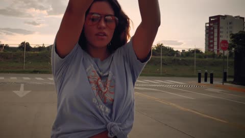 Girl skating down the street in a close shot