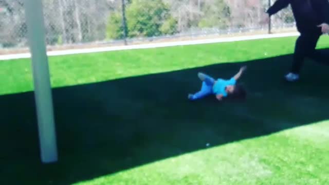 Blue shirt girl walks into swing set gets hit in head