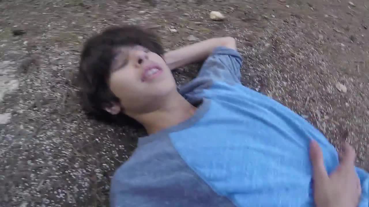 Boy blue shirt forest back flip fail