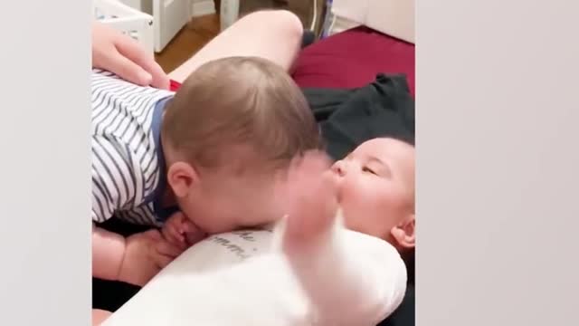 Brother is teasing his brother, the little one is laughing so happily