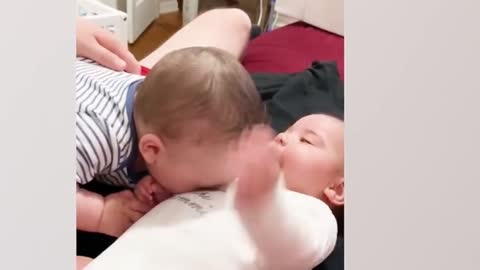Brother is teasing his brother, the little one is laughing so happily
