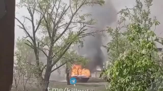 A BURNING BMP-1, POSSIBLY WITH ORKOCHKI INSIDE, DETONATING AMMUNITION MAKES THIS PICTURE EPIC