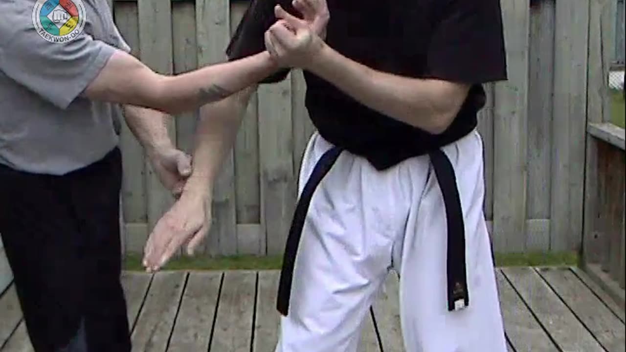 Baehr Taekwondo: white-belt-two-hand-holding-03-closeup