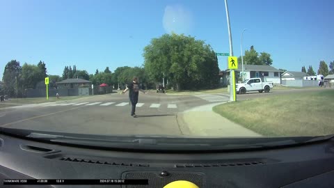 Street-Crossing Pedestrians Dodges Turning Vehicle