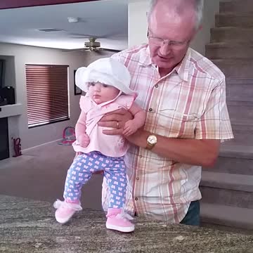 Grandpa Sings Song As He Helps Baby Dance