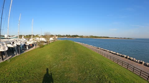 Drone footage. Two rivers meet the sea.