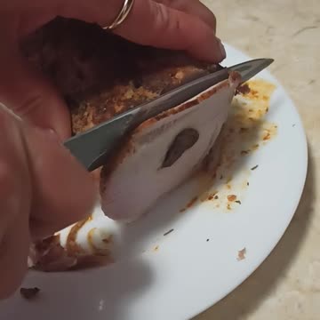 Slicing stuffed pork