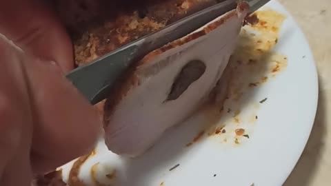Slicing stuffed pork