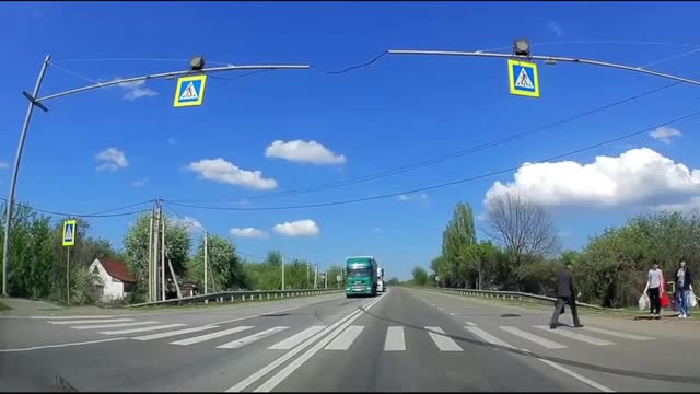Truck almost hits an old man crossig the street!