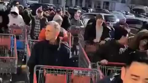 Concerned citizens head to a Costco in Brooklyn.