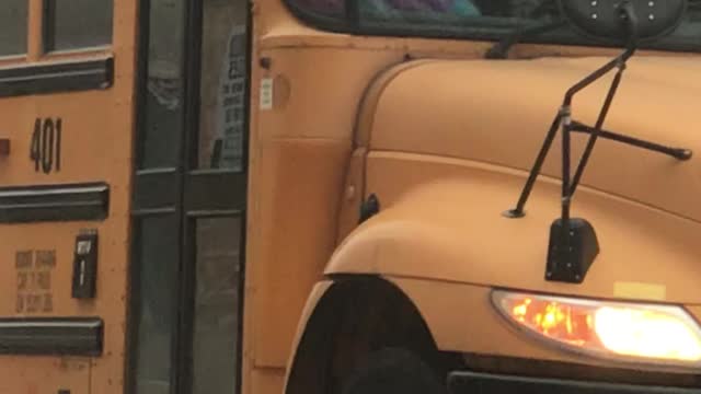 Woman Smoking on School Bus