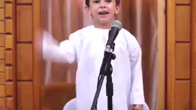 A very young sheikh memorizing the Quran