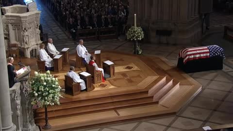 Wrinkled flag on Traitor Mccain's casket