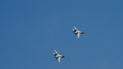 Military jets crossing the blue sky