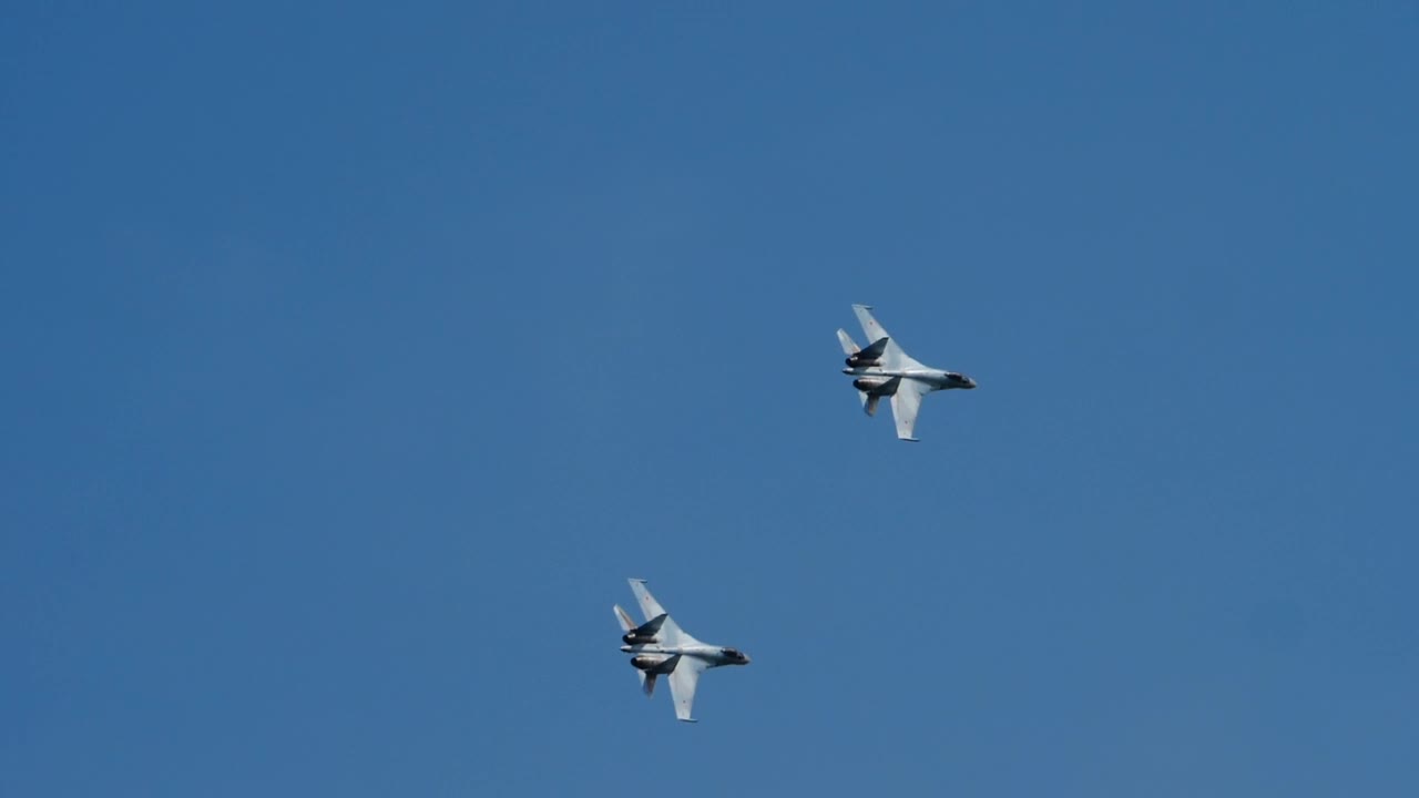 Military jets crossing the blue sky
