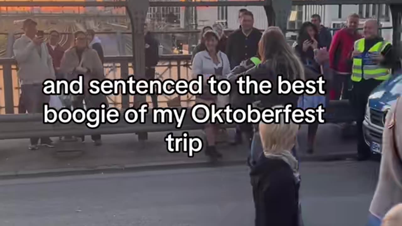 Police Officer Invites Woman To Dance During Oktoberfest