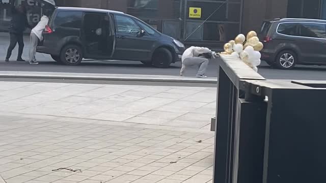 Balloons Drag Woman Down in Heavy Wind