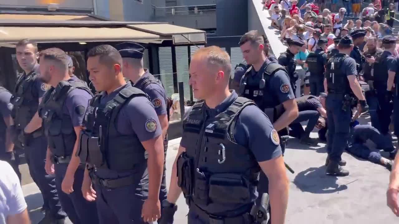Paris, France: Police club protesters with batons (July 15, 2022)