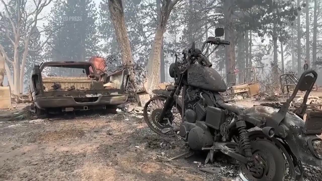 Devastation and smoke rise from the ashes of California wildfires