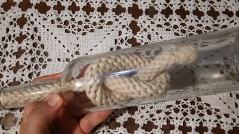 KNOT INSIDE A GLASS BOTTLE