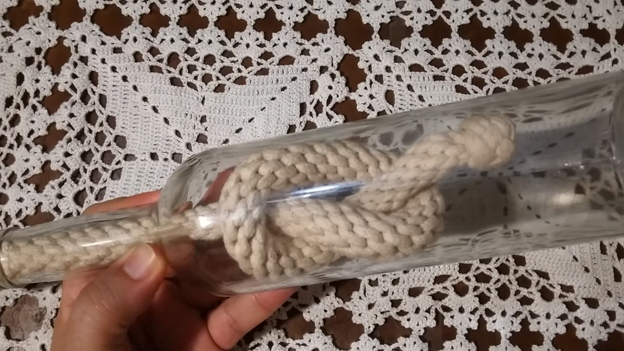 KNOT INSIDE A GLASS BOTTLE