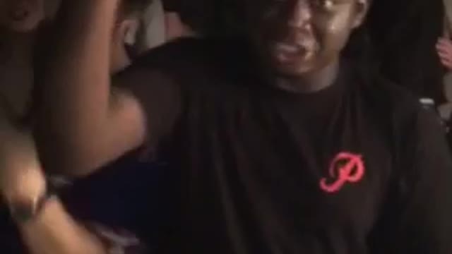 Guy black shirt trying to open beer with head and fails