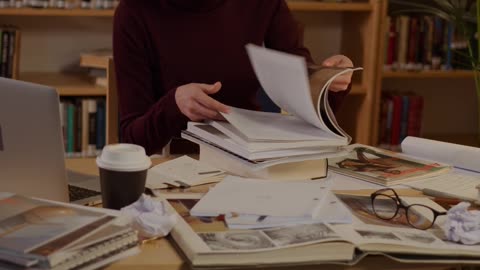 A Woman Looking at Books
