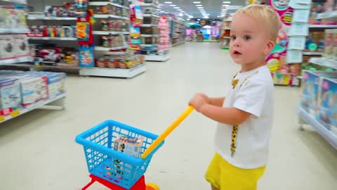 Chris and mom doing shopping in Toy store