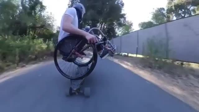 Downhill longboarding in a wheelchair