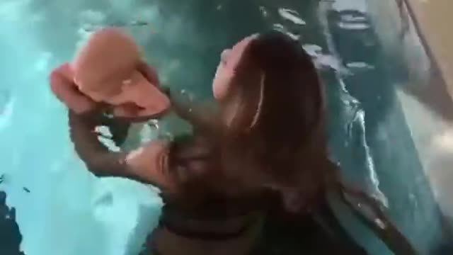 Mother teach Swimming to her kid