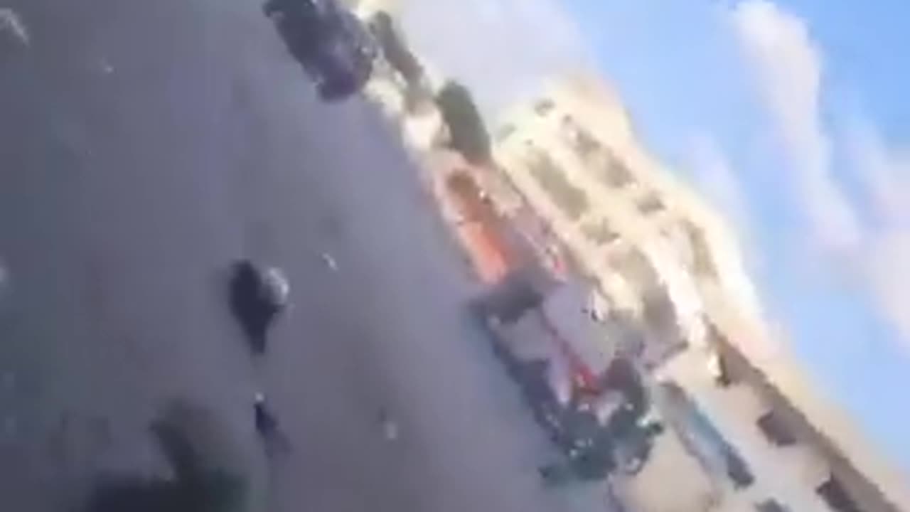 Footage depicts an Israeli airstrike hitting a group of Palestinian civilians