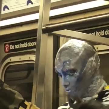 Guy in silver blue alien makeup
