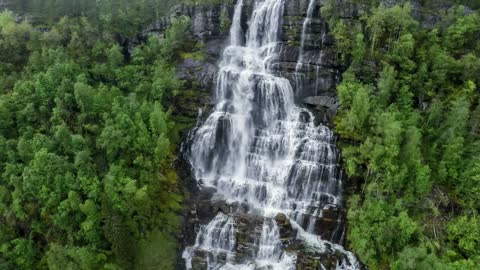 aerial footage from tvindefossen waterfall from the birds eye view norway