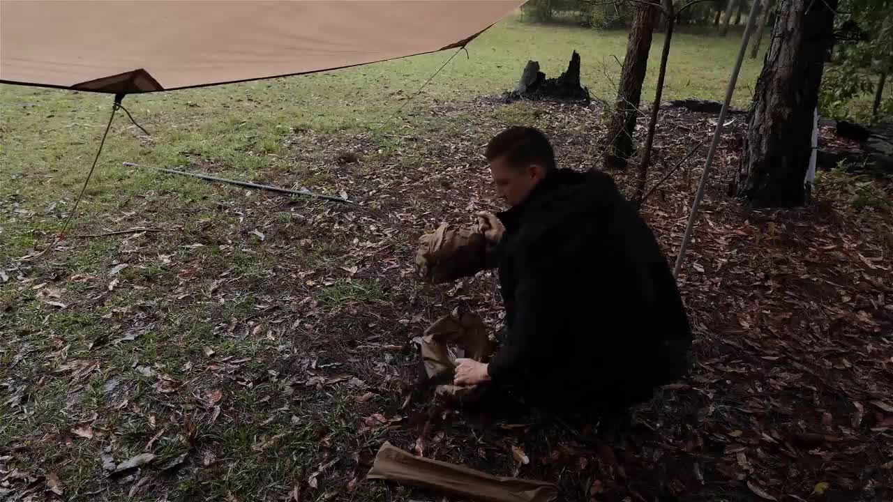 Camping out in the rain and setting up tents