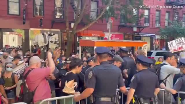 Pro and anti-abortion protesters face off outside NYC church