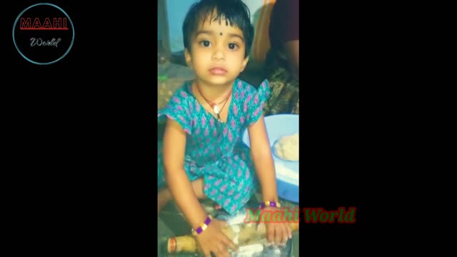 Little girl making maahi cuthe girl